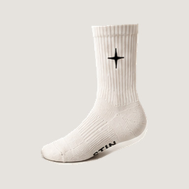 Crew Sock 01 in Vintage White, outer side view with four-point cross and naturally partial underside lettering. Design concept.